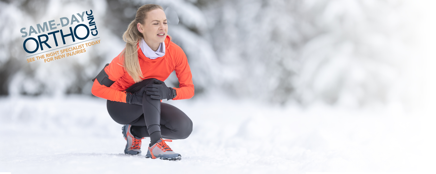 female runner holding knee