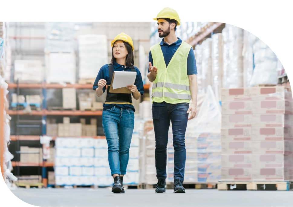 Photo: Two people working in a warehouse