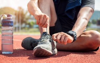 Photo: Runner tying their shoes