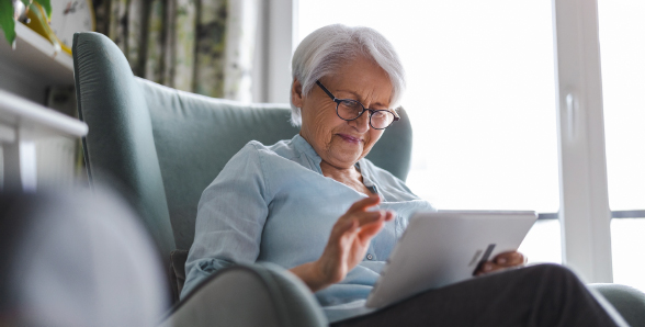 Photo of an older woman using a tablet